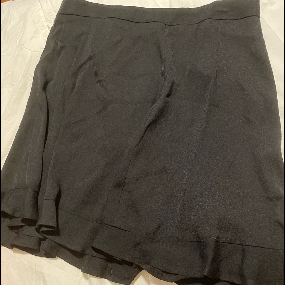 Reformation black skirt size 10 with light frill on hem